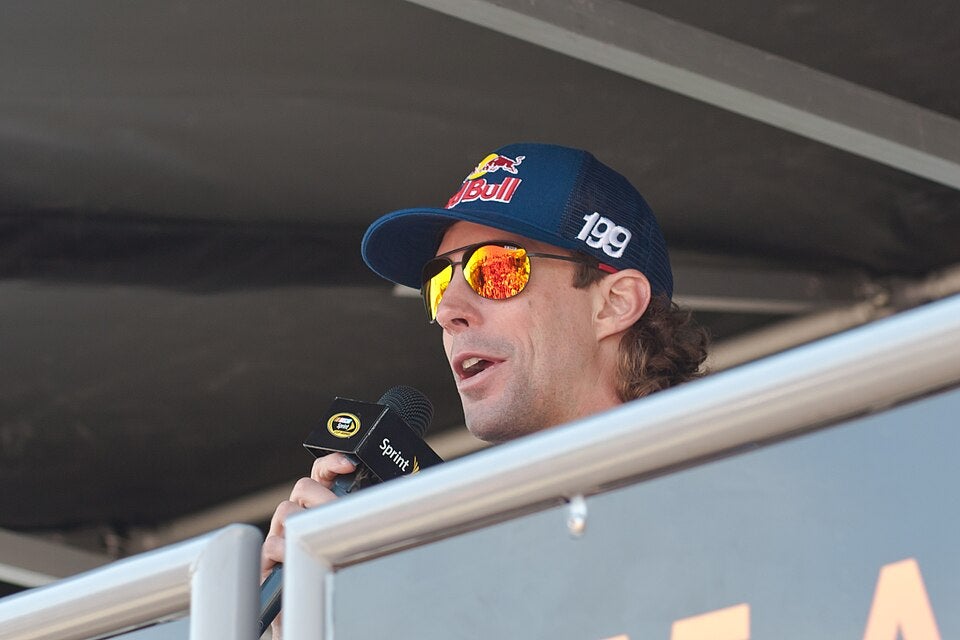 Travis Pastrana speaking into a Sprint microphone at the Virginia 250 in 2012